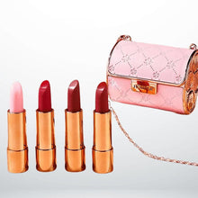 Coffret HOMPAR, pochette rose et quatre rouges à lèvres