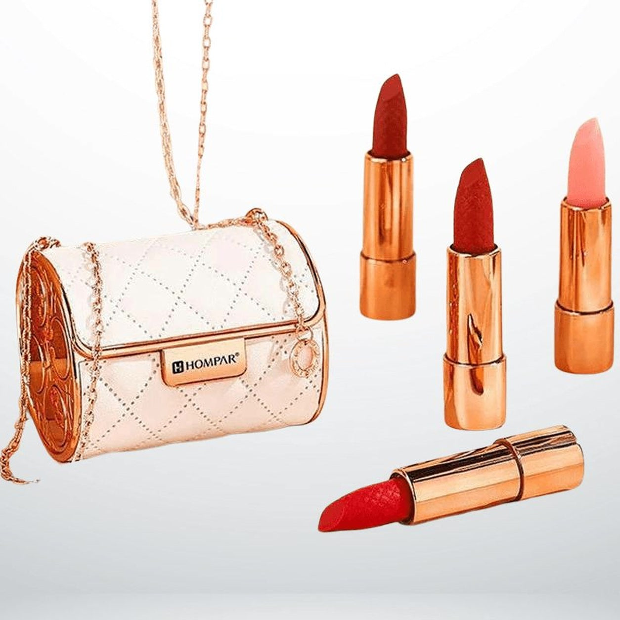 Coffret HOMPAR, pochette blanche et quatre rouges à lèvres
