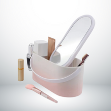 Valise beauté LED rose ouverte avec accessoires de maquillage